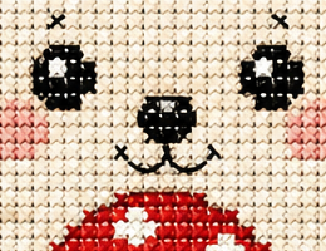 Close-up of the hedgehog's face showing thread texture and shading inside each cross